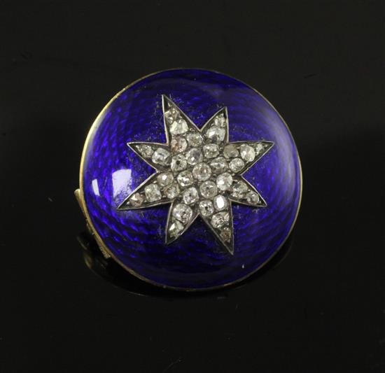 A Victorian gold, blue guilloche enamel and old cut diamond set circular brooch, 22mm.